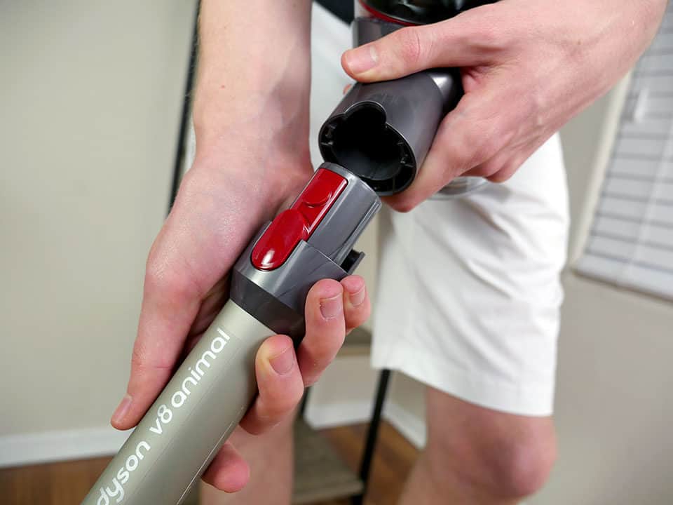 Dyson V8 Animal wand being inserted into the connection point Dyson V8 Animal wand being inserted into the connection point
