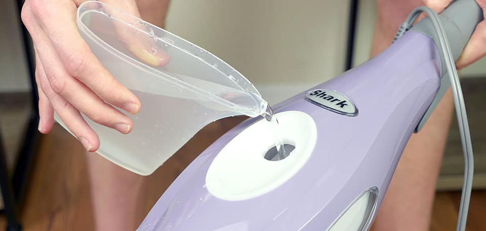Pour water directly into the tank before plugging the mop in
