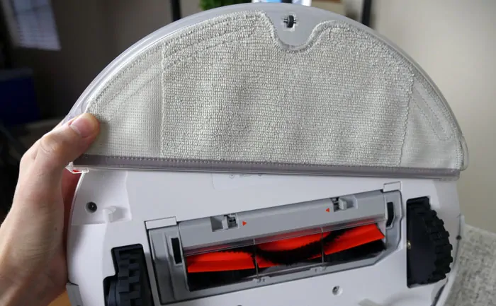 Snapping the Roborock S5 mopping attachment into place