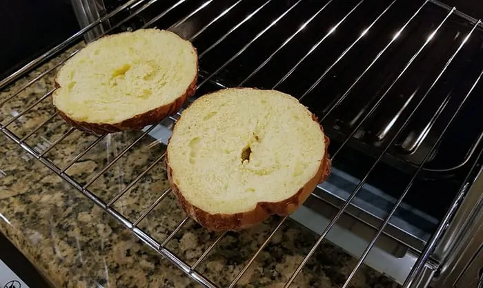 https://moderncastle.com/wp-content/uploads/2019/11/toasting-bagel-in-cosori-toaster-oven.webp