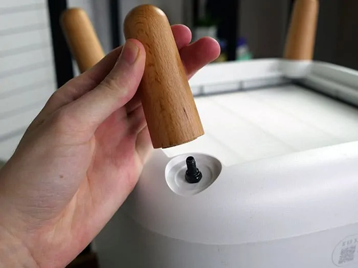The legs screw into the base on the SQ air purifier
