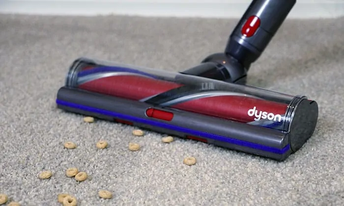 V11 Outsize cleaning large debris from carpet