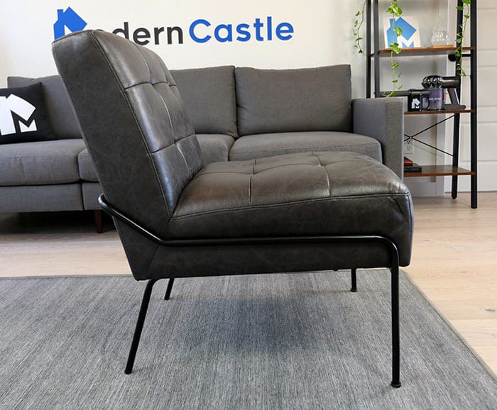 Side view of the eLuxury armless tufted accent chair 